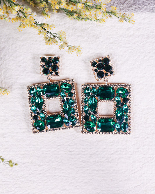 green dangler earrings