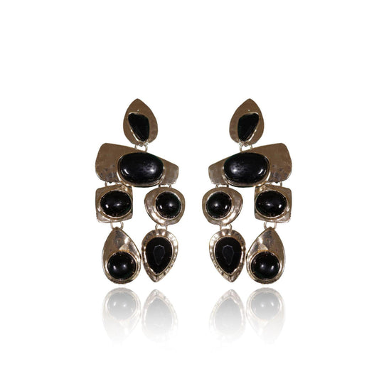 Black and Gold Danglers: Greek-inspired silver earrings with geometric shapes, adorned with multiple black oval and teardrop stones, shown on a white background with a subtle reflection below.