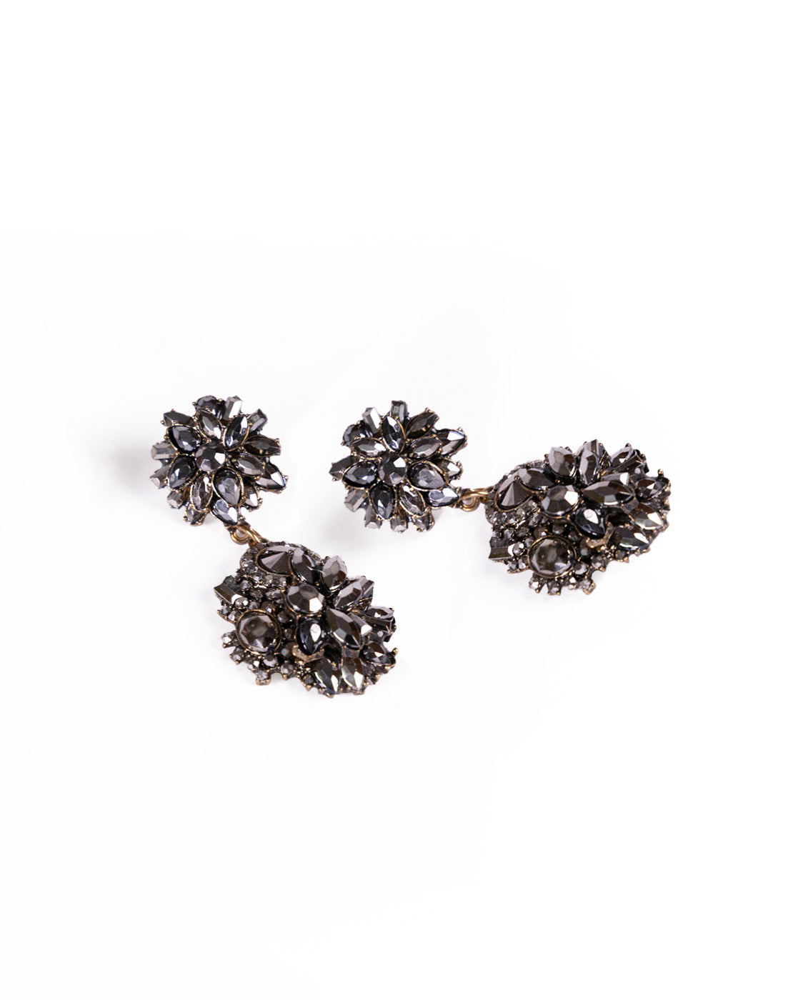 Black Magic Earrings: Vintage-style 24K gold-plated earrings featuring dark, faceted gemstones in floral clusters set on a metallic base, displayed against a white background.
