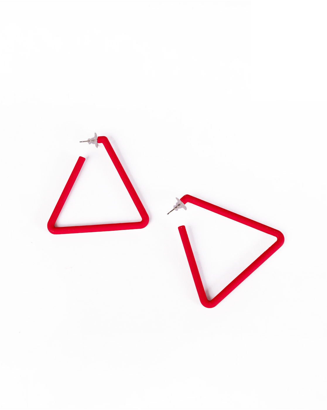 Triangle Earrings: Red, open triangle design with silver studs for affordable luxury, shown on a white background.