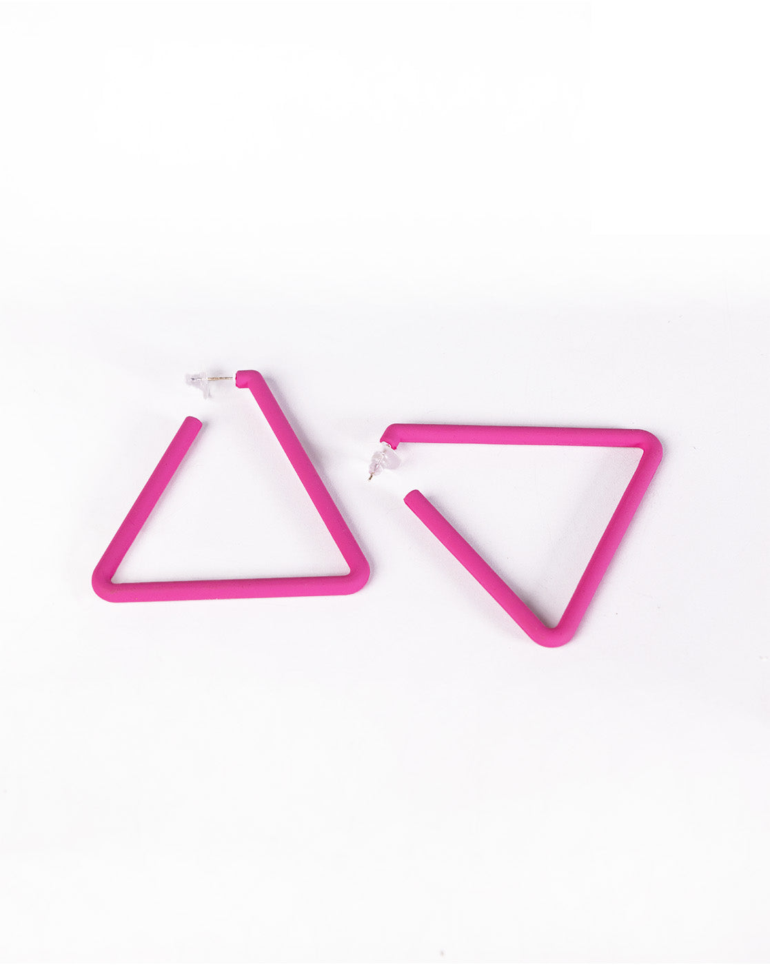 The Triangle Earrings feature a minimalist, modern open-triangle design in bright pink with post backings, displayed on a white background—an affordable luxury accessory.