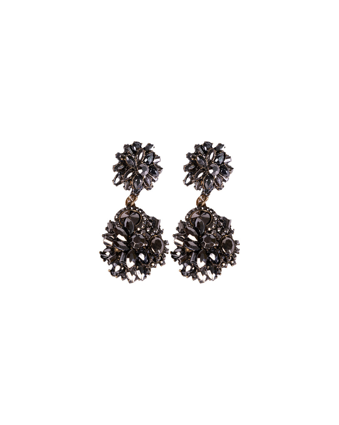 The Black Magic Earrings are ornate dangle earrings made from brass alloy, featuring intricate circular floral patterns and small gemstone accents at both the top and bottom.