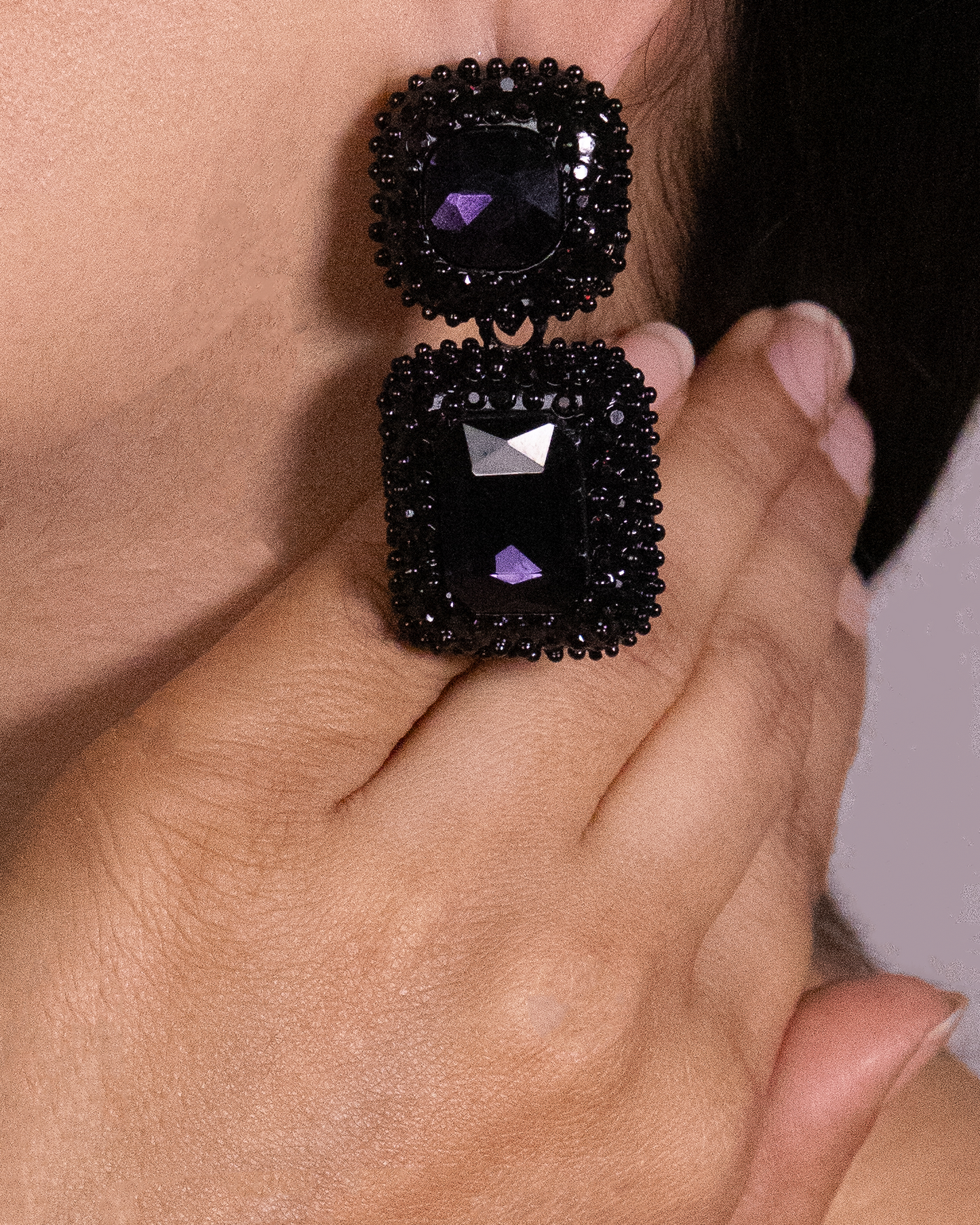 Black and purple dangler earrings