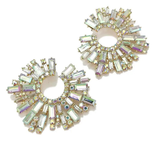 The Circle of Maze Earrings are circular, gold-plated earrings with iridescent baguette and round crystals in a sunburst design for a radiant, sparkling effect.