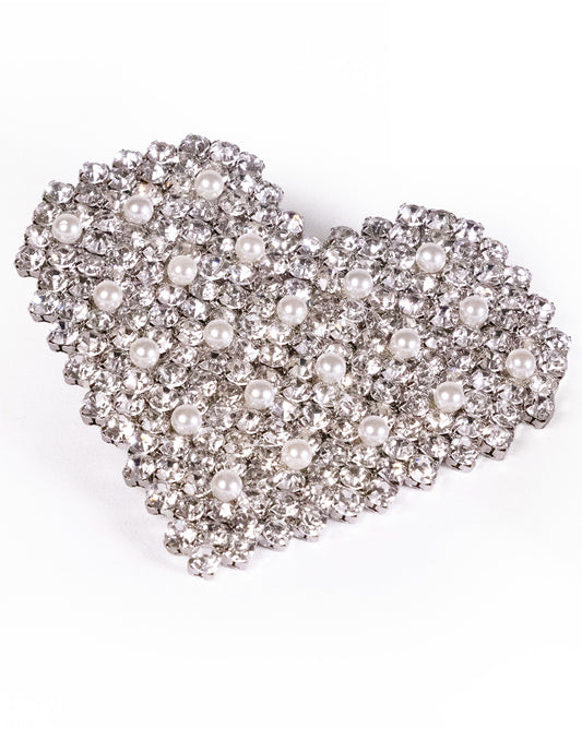 Large Crystal Hearts: This sparkling heart-shaped brooch, adorned with clear rhinestones and white pearls in a symmetrical design, is the perfect companion to your favorite crystal and pearl earrings. Photographed on a crisp white background.