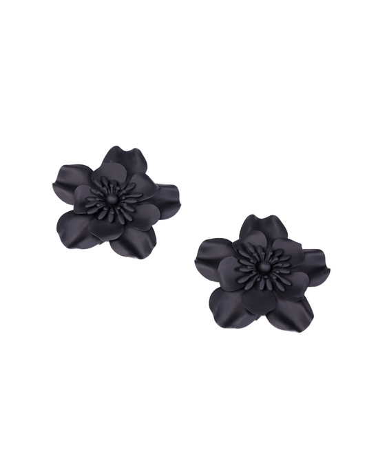 Large black flower earrings made from brass alloy with petal details and textured centers are shown on a white background, offering an affordable touch of luxury jewelry.